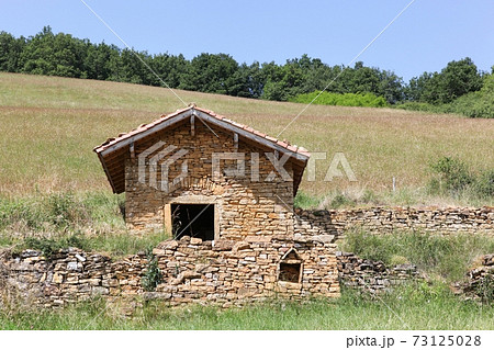 Typical stone hut called cadole in french language in the village of Theize, Beaujolais, France 73125028