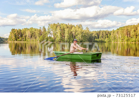 Fisherman in a boat 73125517