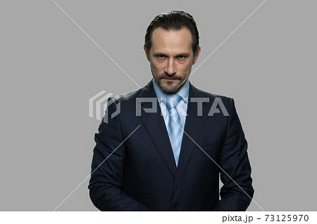 Agressive mature businessman looking at camera. Agressive mature businessman looking at camera. 73125970