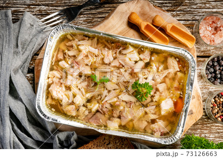 Jelly with shredded chicken meat in a mold. 73126663