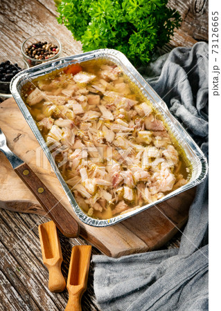 Jelly with shredded chicken meat in a mold. Jelly with shredded chicken meat in a mold. 73126665