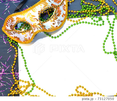 Mardi gras mask and beads frame for text on white space background. Madi gras celebration fat tuesday carnival Mardi gras mask and beads frame for text on white space background. Madi gras celebration fat tuesday carnival 73127050
