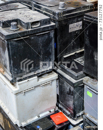 A pallet with used car batteries awaiting recycling A pallet with used car batteries awaiting recycling 73127792