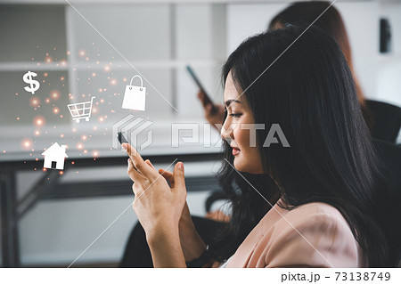 women using smartphone with shopping online concept women using smartphone with shopping online concept 73138749