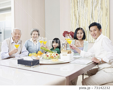 happy three-generation family having meal at home happy three-generation family having meal at home 73142232