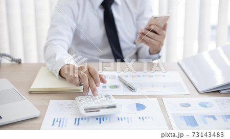 Accounting businessmen are calculating income-expenditure and analyzing real estate investment data, Dedicated to the progress and growth of the company, Financial and tax systems concept. Accounting businessmen are calculating income-expenditure and analyzing real estate investment data, Dedicated to the progress and growth of the company, Financial and tax systems concept. 73143483