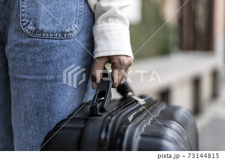 Asian woman carrying a big black bag to travel during the vacation of the year, Trolley bag, Long weekend travel, Love the trip, Tourism festival concept. 73144815