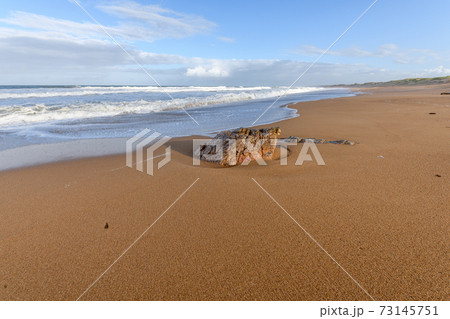 Sandy beach along the Atlantic Ocean in France. 73145751