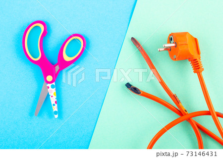 burnt electrical wire with baby scissors 73146431