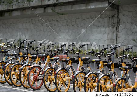 Yellow bicycles called Mobike sharing bicycle beside the street Yellow bicycles called Mobike sharing bicycle beside the street 73148650