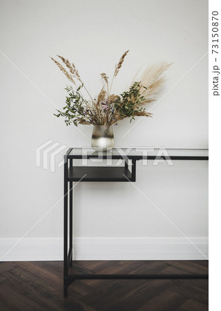 Stylish metal table in interior Stylish metal table in interior 73150870