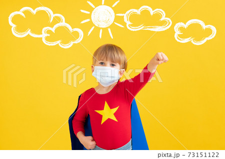 Superhero child wearing protective mask 73151122