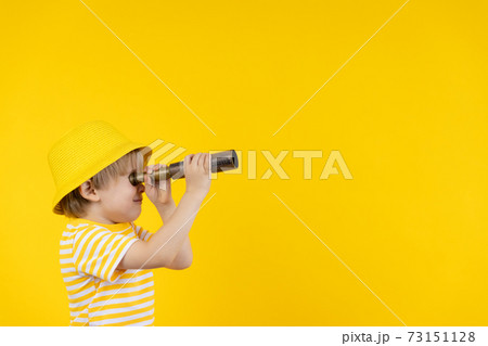 Portrait of kid wearing protective mask against yellow background Portrait of kid wearing protective mask against yellow background 73151128