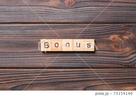 bonus word written on wood block. bonus text on table, concept bonus word written on wood block. bonus text on table, concept 73154140