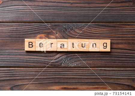 Beratung word written on wood block. Beratung text on cement table for your desing, concept Beratung word written on wood block. Beratung text on cement table for your desing, concept 73154141