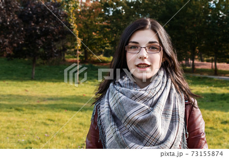 portrait of a young girl in the park in autumn portrait of a young girl in the park in autumn 73155874