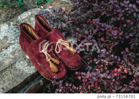 men's shoes moccasins cherry color. photo on the street 73156701