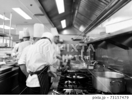 Chef cooking in a kitchen, chef at work, Black and White. 73157479