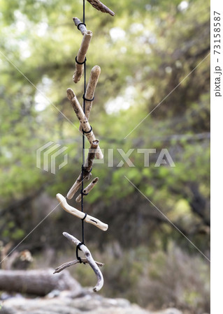 A wooden necklace on a tree in Greece A wooden necklace on a tree in Greece 73158587