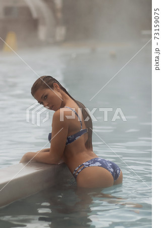 Sexy woman in hot pool 73159075