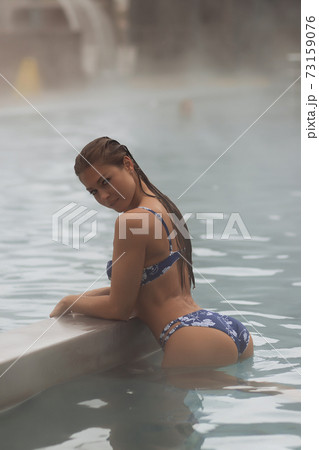 Sexy woman in hot pool 73159076