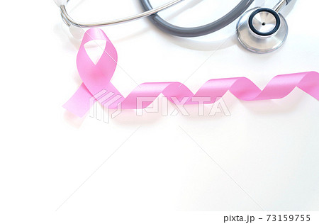 Pink ribbon and stethoscope on white background, closeup.  cancer awareness concept 73159755