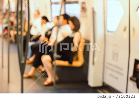 Blur Image of People traveling to work using the BTS (Bangkok Transit System) in the morning, Bangkok. Thailand Thai transportation system. vintage tone colour 73160323