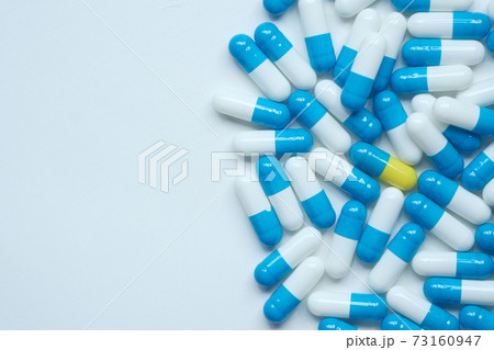 Close up of many colorful pills and capsules  73160947