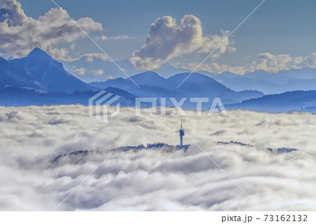 Mont-Gibloux and Alps mountains upon clouds, Fribourg, Switzerland 73162132