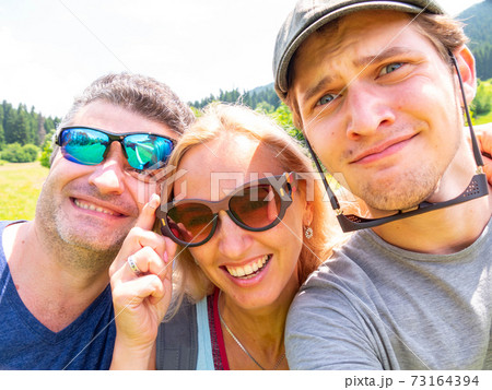 Funny family on a vacation in Georgia makes selfie Funny family on a vacation in Georgia makes selfie 73164394