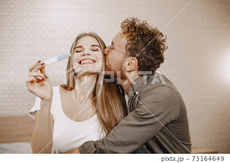 Couple finding out results of a pregnancy test Couple finding out results of a pregnancy test 73164649