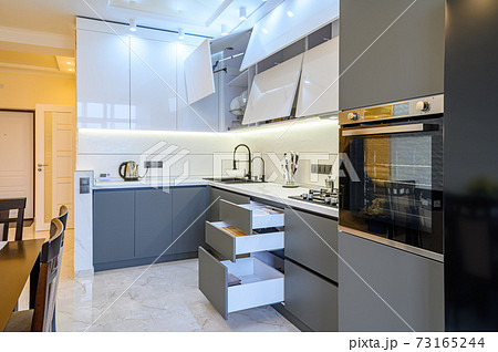 Luxury white and dark grey modern kitchen interior 73165244