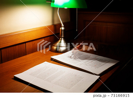 blurred proofreading paper on wooden table blurred proofreading paper on wooden table 73166915