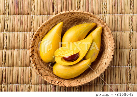 Eggfruit or canistel in a basket, Thai fruit 73168045