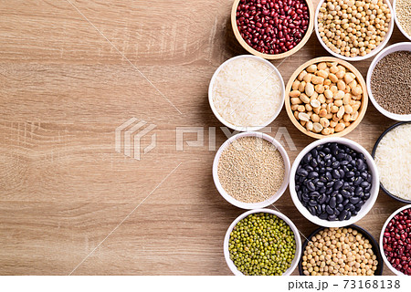 Various cereal grain in a bowl on wooden background 73168138