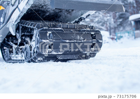 Rear suspension of a snowmobile in winter. Riding in the snow Rear suspension of a snowmobile in winter. Riding in the snow 73175706