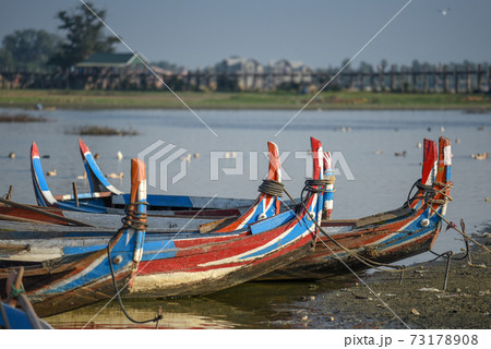 traditional boat near the U Bein Bridge, Mandalay, Myanmar 73178908