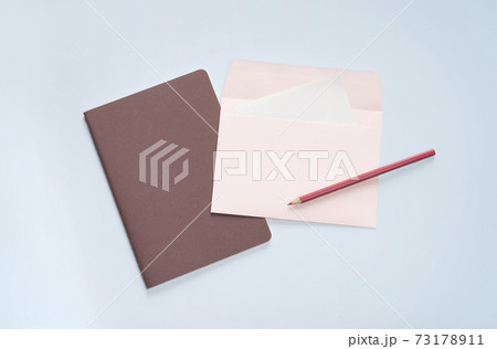 flat lay pink letter and pencil stationery 73178911