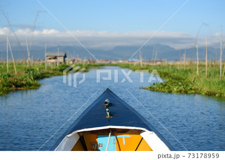 Travel boat in the local village of Inle lake, Myanmar Travel boat in the local village of Inle lake, Myanmar 73178959