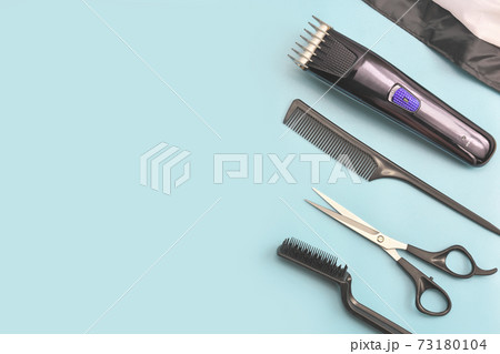barber's tools on blue background. hair clipper, 73180104