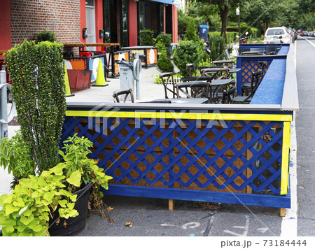 Outside dinning set up and blocked off in the street in Astoria Queens 73184444