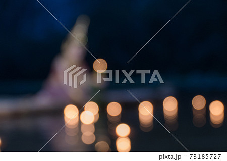 Bokeh night fire candlelight in loy Krathong Festival.Blur Photo candles floating in the Lake Bokeh night fire candlelight in loy Krathong Festival.Blur Photo candles floating in the Lake 73185727