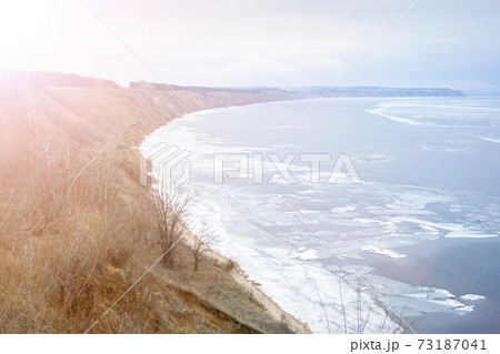 View of the Volga River from a high cliff in the spring afternoon. 73187041