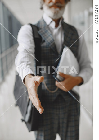 Handsome pensive mature businessman in formal suit Handsome pensive mature businessman in formal suit 73187284