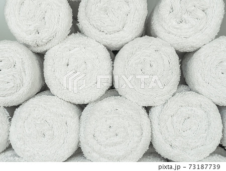 White towel roll pile in gym, swimming pool, bathroom or spa for background White towel roll pile in gym, swimming pool, bathroom or spa for background 73187739