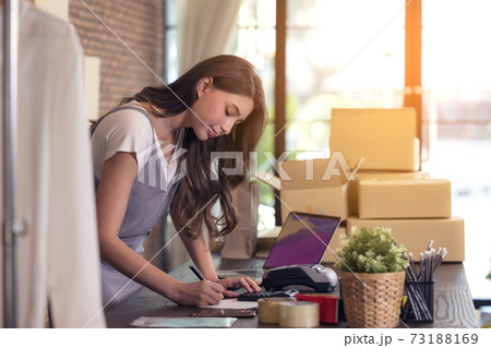 Young woman tailor with laptop is answering emails, Business woman entrepreneurial success . Sales Online Parcel delivery 73188169