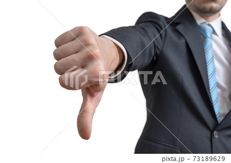 Businessman is showing thumbs down gesture. Isolated on white ba 73189629