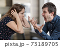 Divorce concept. Young angry couple arguing and shouting. 73189705