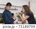 Jealousy hysterical woman is blaming and shouting on her husband 73189709