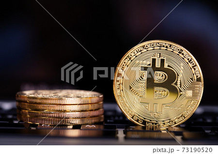 Bitcoin on laptop keyboard 73190520